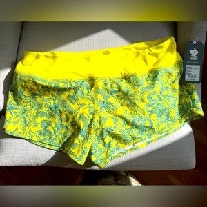 Rabbit run shorts Medium.  Yellow hibiscus.  NWT